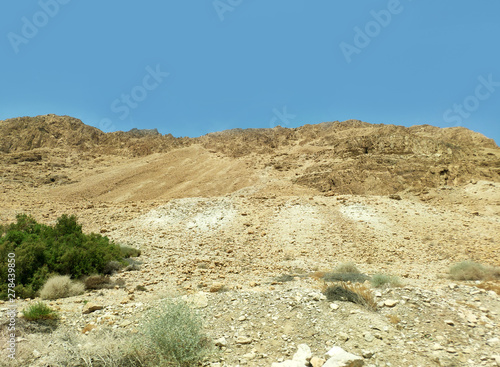 Desert landscape with rocks, hills and mountains