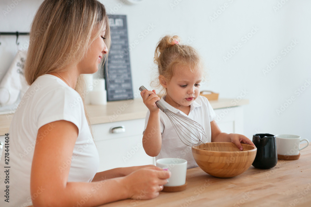 Mother and daughter Cooking in kitchen. Happiness Cooking Activity Concept Mother and daughter Cooking in kitchen. Happiness Cooking Activity Concept
