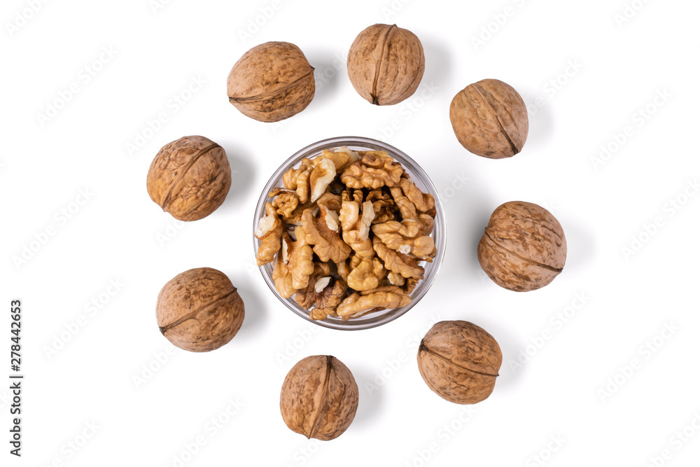 Whole and chopped walnuts in a glass bowl arranged in a circle. Isolated on white background Whole and chopped walnuts in a glass bowl arranged in a circle. Isolated on white background