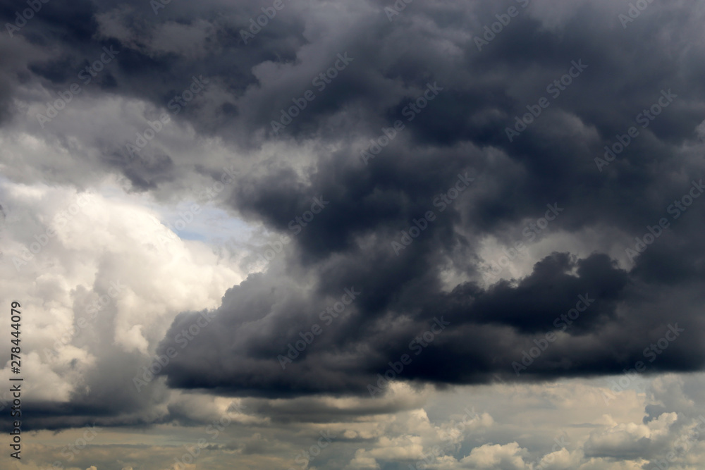 Fototapeta premium Storm sky covered with dark cumulus clouds before the rain. Dark cloudy sky, overcast day, beautiful dramatic background for rainy weather