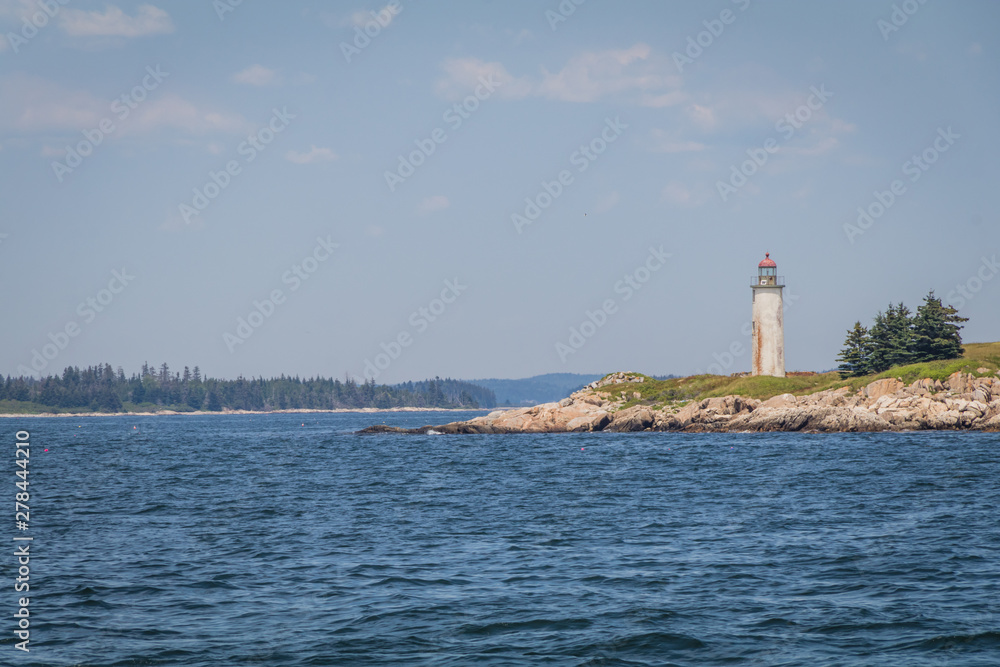 Franklin Island Lighthouse on a sunny summer day on Franklin Island, Muscongus Bay, Maine