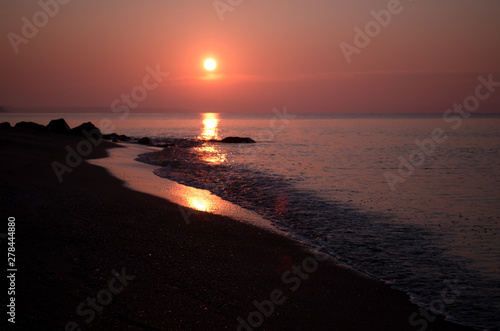Early morning on the coast of the sea. Sunrise seascape.