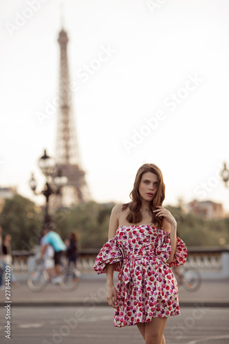 Beautiful girl is walking in Paris with Eiffel tower view , France