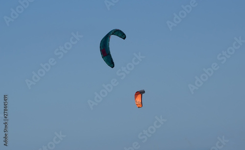 Two kite surfers over the Mediterranean Sea 