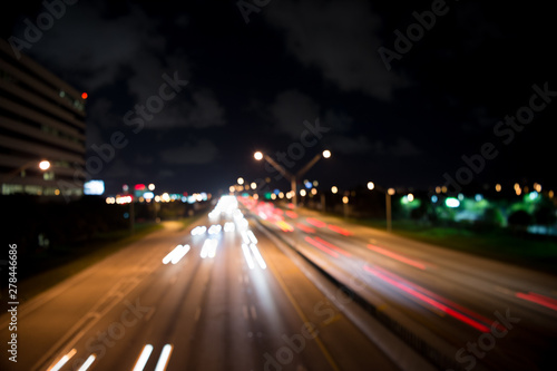 blurred night city lights. defocused speed background. blur night life. illumination. Abstract urban night light defocused background. Nightscape Fuzzy. Abstract background of city in motion blur