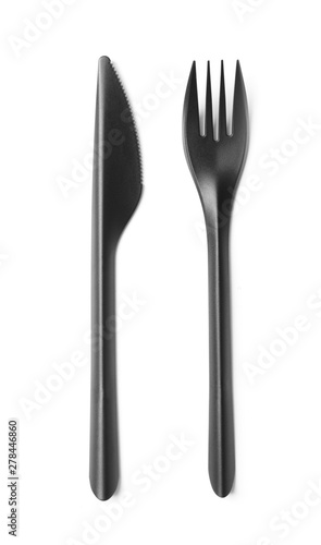 Black plastic knife and fork isolated