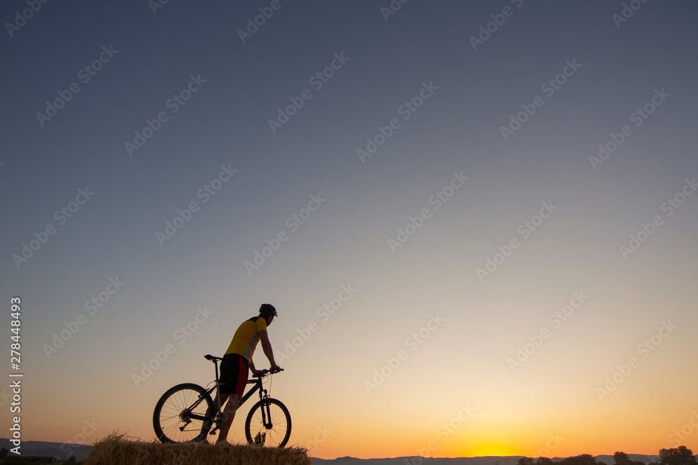 Man with mountain bike and yellow shirt Man with mountain bike and yellow shirt