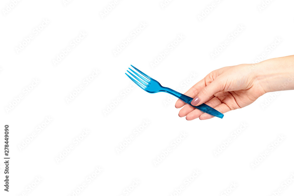Hand with blue plastic fork, disposable utensil. Hand with blue plastic fork, disposable utensil.