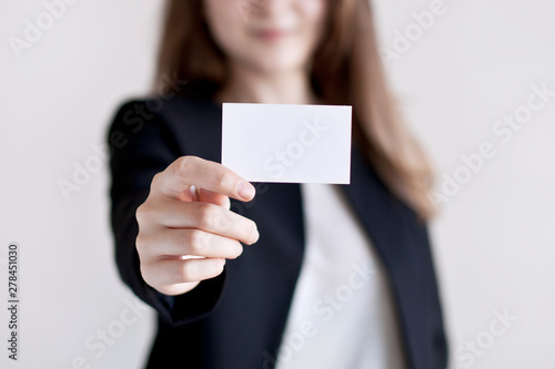 Business woman holding the business card.