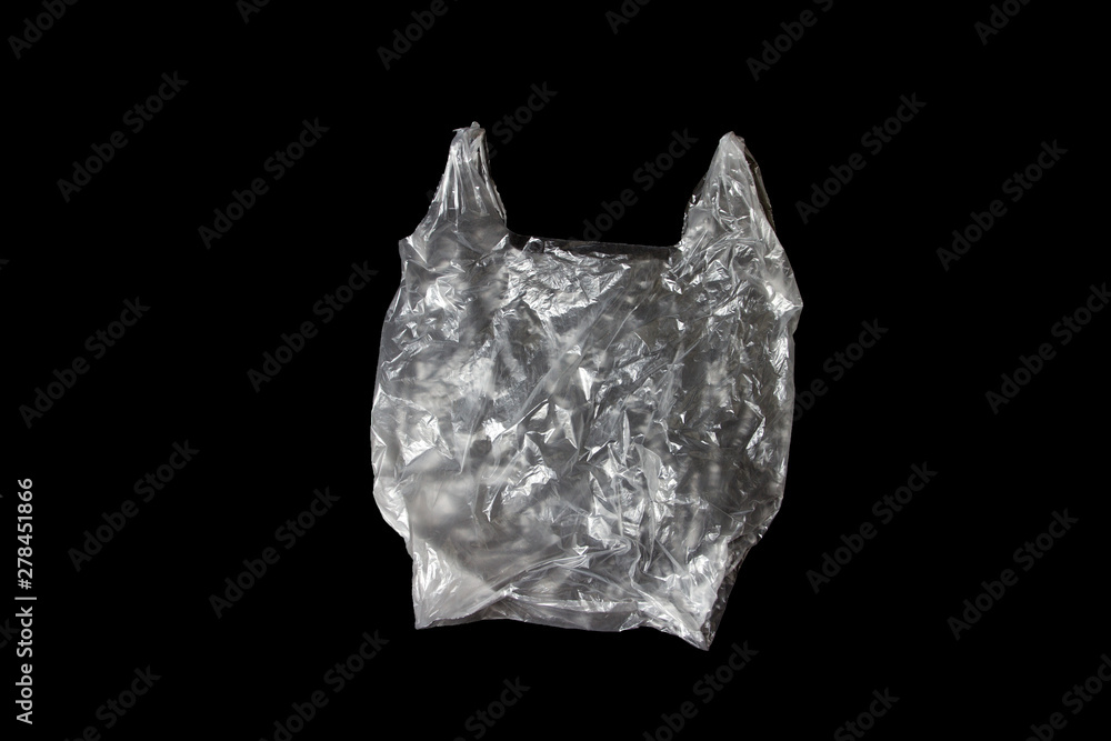 it is one white plastic bag isolated on black. it is one white plastic bag isolated on black.