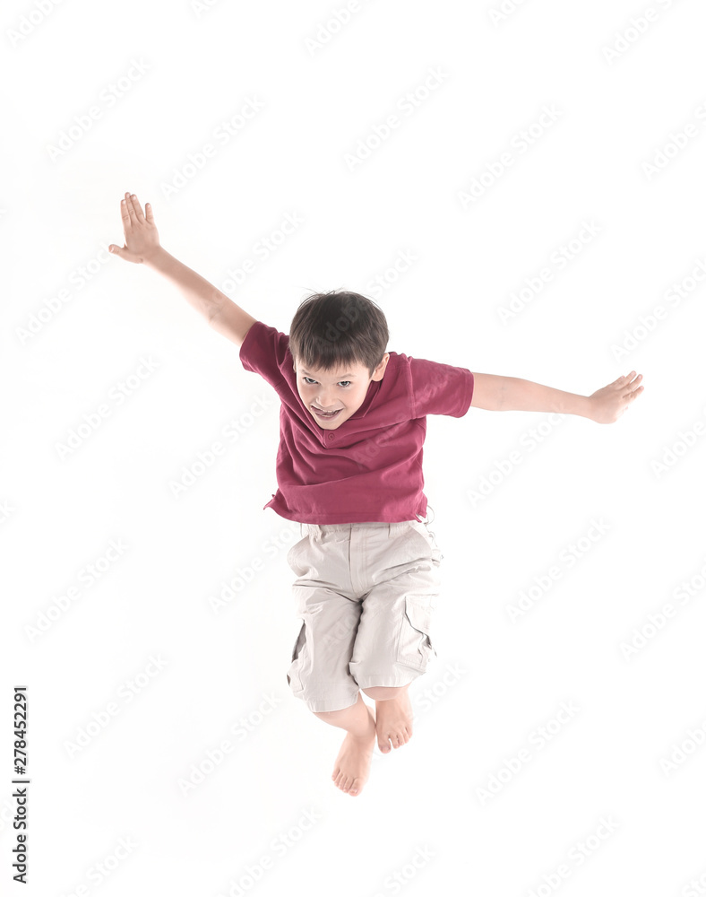 little boy performs a jumping exercise.isolated on white little boy performs a jumping exercise.isolated on white
