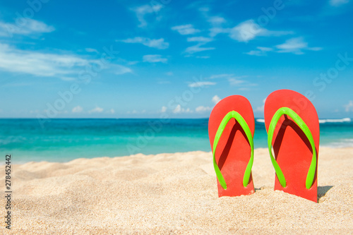 Holidays Background. Beach sandals on the sandy coast  Thailand