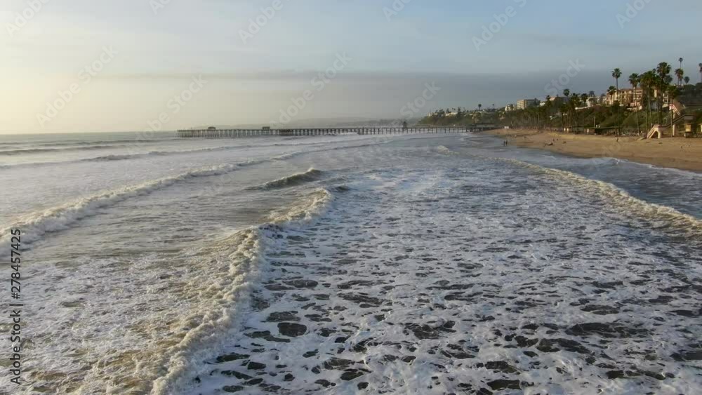 Aerial view of San Clemente Pier with beach and coastline before sunset time . San Clemente city in Orange County, California, USA. Aerial view of San Clemente Pier with beach and coastline before sunset time . San Clemente city in Orange County, California, USA.
