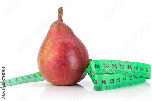 One whole fresh dark red pear anjou with a green tape measure isolated on white background photo