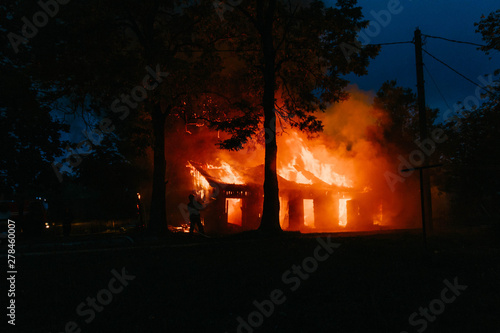 Photos fire in a wooden house. real arson building.
