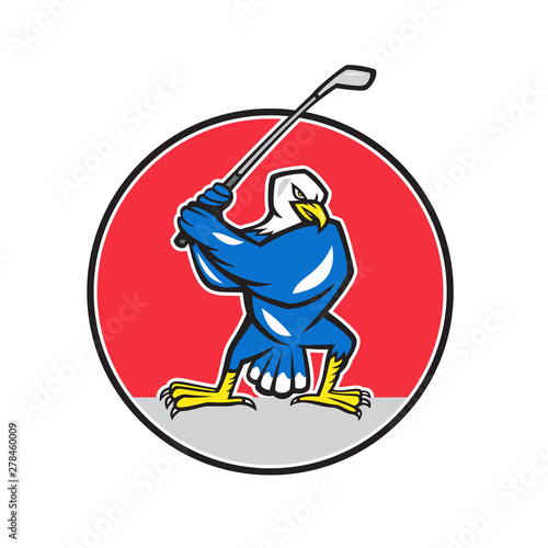 Illustration of a blue American bald eagle golfer with golf club teeing off set inside circle on isolated background done in cartoon style.