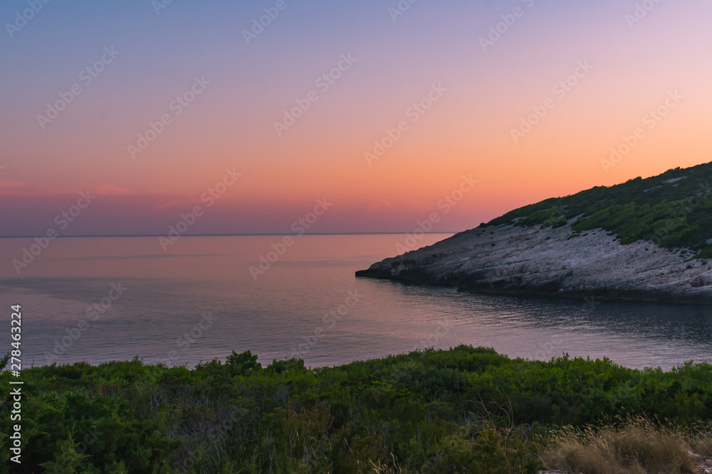 Landscape view of a bay in golden Mediterranean sunset, Vis island, Croatia, Europe