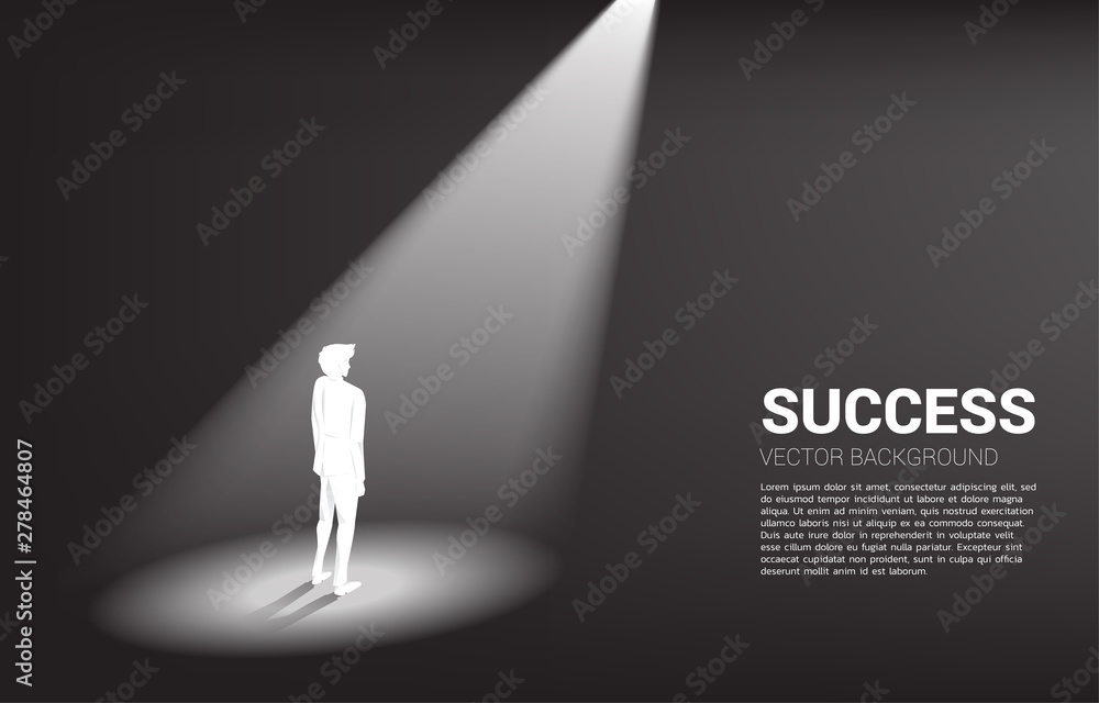 Obraz premium Silhouette of businessman standing in spotlight. business concept of mission vision and leadership