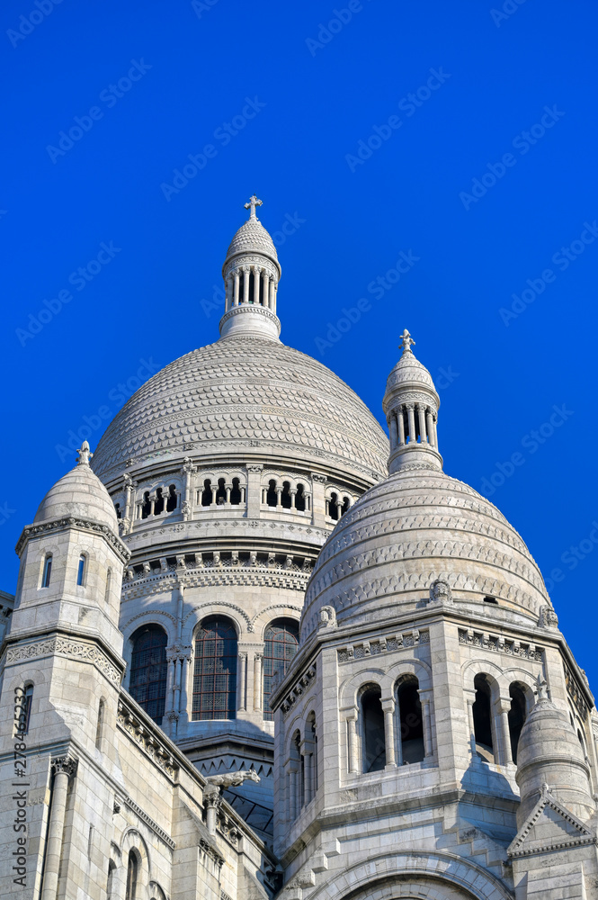 The Basilica of the Sacred Heart of Paris, commonly known as Sacré-Cœur Basilica, located in the Montmartre district of Paris, France. The Basilica of the Sacred Heart of Paris, commonly known as Sacré-Cœur Basilica, located in the Montmartre district of Paris, France.