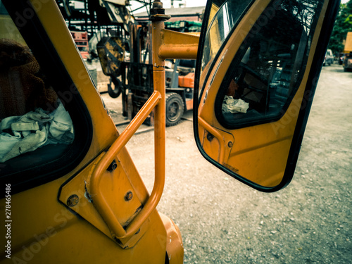 Side mirror shining reflective shots into the car interior construction materials raised face wash.