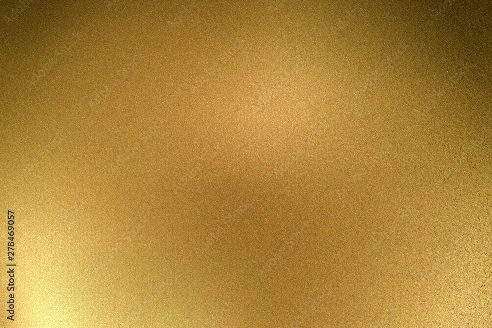 Light shining on gold metallic plate in dark room, abstract texture background Light shining on gold metallic plate in dark room, abstract texture background