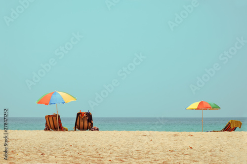 Beach chair on tropical beach with calm sky. sea view and sand beach  summer vacation background. retro color tone effect.