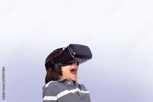 Little boy playing video games with VR. © Mego-studio