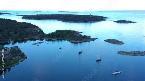 Luxury sailing yachts moored in a picturesque bay near Sandhamn, a town on the Stockholm Archipelago. photo