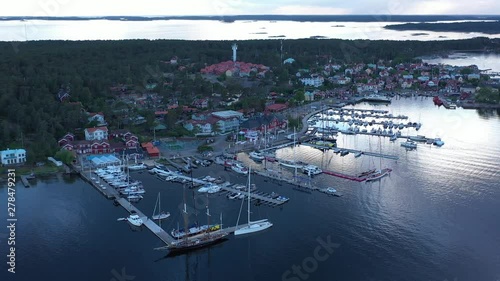 High aerial orbit over the Sandhamn marina as boats arrive for the annual round Gotland boat race. photo