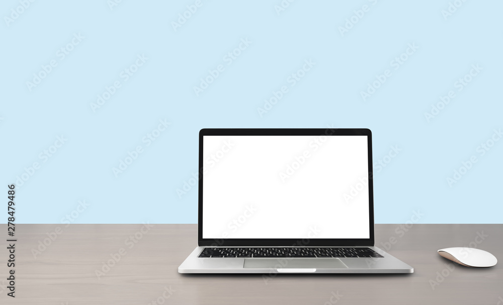 Blank display screen laptop computer on wood table, isolated on blue turquoise wall background in office, business concept. Mockup with copy space. Blank display screen laptop computer on wood table, isolated on blue turquoise wall background in office, business concept. Mockup with copy space.