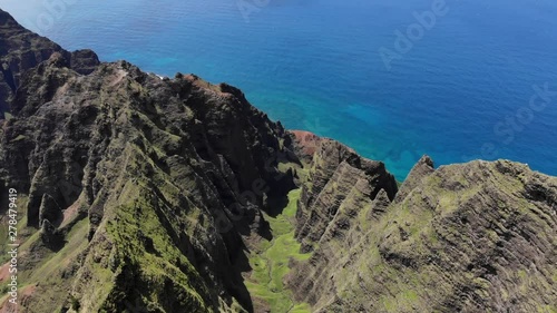 Version Three. Aerial Drone Rising from the Na Pali Coast Mountains and Kalalau Valley in Hawaii. photo