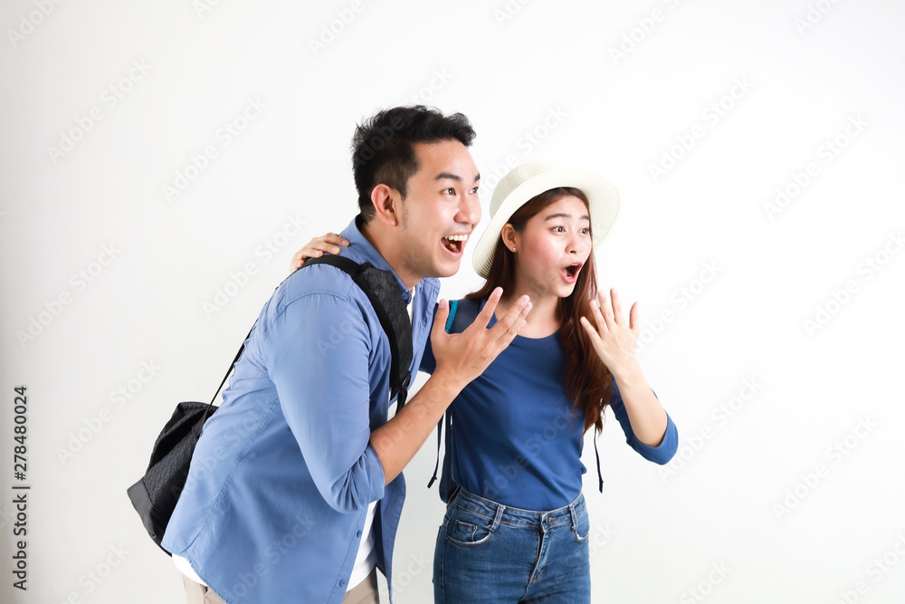 Asian couple in blue shirt with travel bag vintage camera and passport action running and happy smile face excite with travel concept on white background Asian couple in blue shirt with travel bag vintage camera and passport action running and happy smile face excite with travel concept on white background