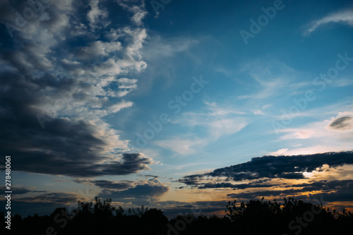 Natural Sunset Sunrise. Bright Dramatic Sky And Dark Ground. Colorful Sky At Sunset Dawn Sunrise. Sun Over Skyline, Horizon.
