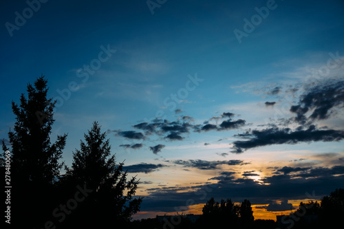Natural Sunset Sunrise. Bright Dramatic Sky And Dark Ground. Colorful Sky At Sunset Dawn Sunrise. Sun Over Skyline, Horizon.