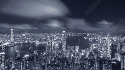 Panorama of Victoria harbor of Hong Kong City at night © leeyiutung