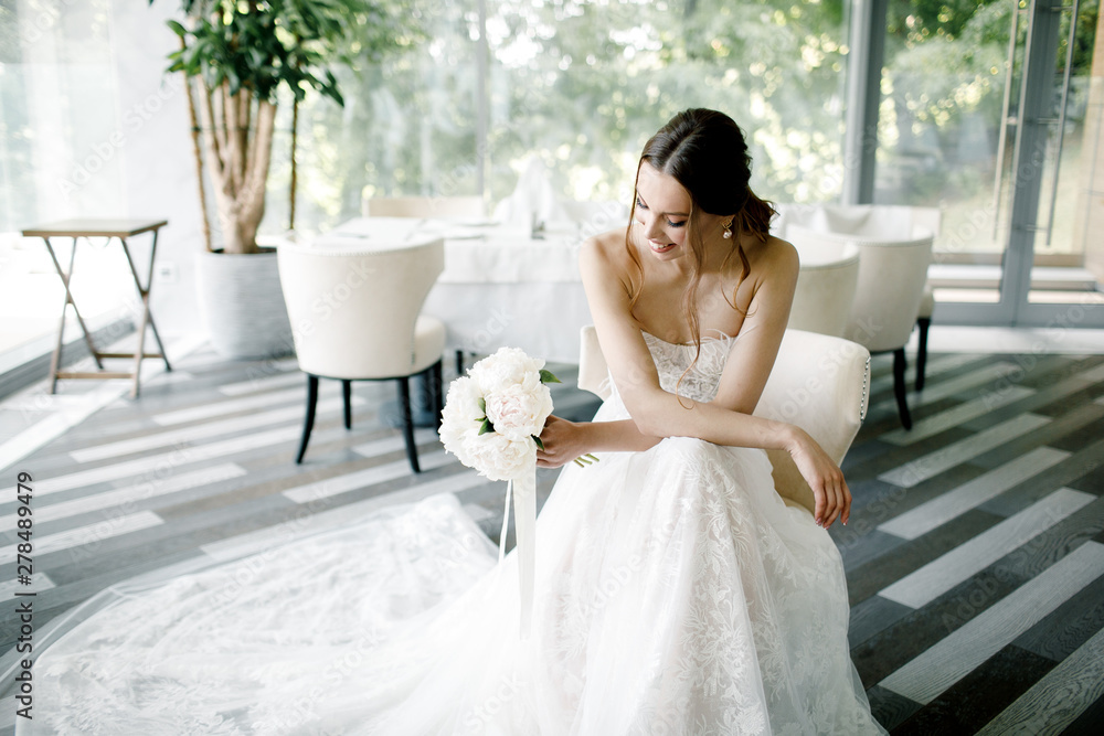 bride wearing a fashion wedding dress in a beautiful restaurant bride wearing a fashion wedding dress in a beautiful restaurant