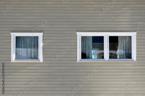 Gray hardwood wall with windows