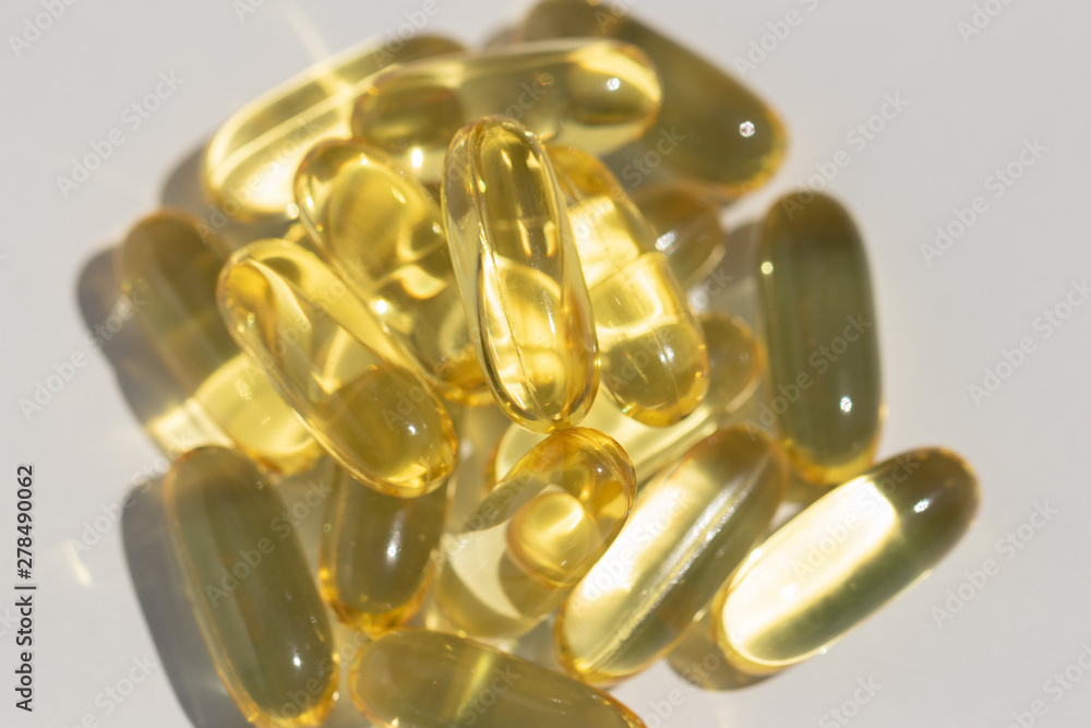 Omega fat capsules on white background top view Omega fat capsules on white background top view