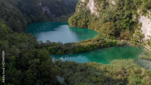 Shot Five. Beautiful Aerial Crane Shot of Plitvice Lakes with Clouds Peeling Away. photo