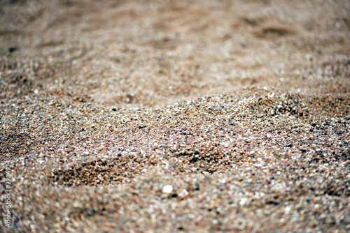 Sea coast sand texture close up. Natural background