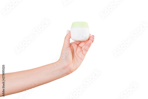 Female hand holding cream bottle of lotion isolated. Girl give jar cosmetic products on white background