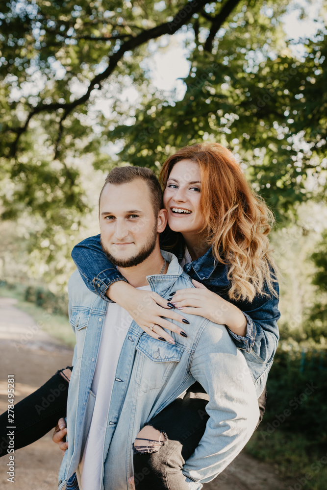 Naklejka premium Happy loving couple outdoor in park .