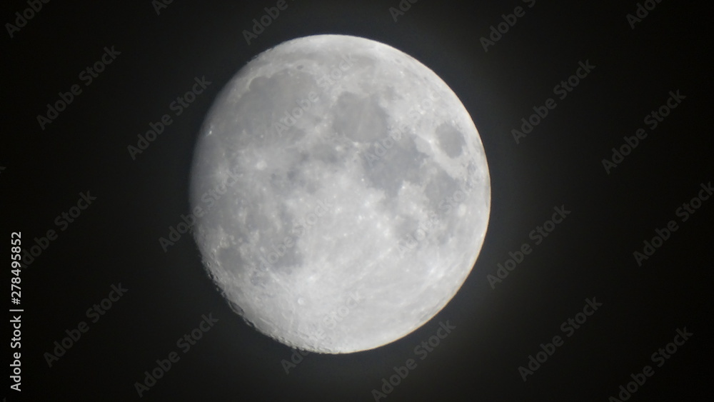 Closeup of moon image 2 days before full moon at night without clouds in summer season, full moon is the lunar phase when the Moon appears fully illuminated from Earth's perspective. Closeup of moon image 2 days before full moon at night without clouds in summer season, full moon is the lunar phase when the Moon appears fully illuminated from Earth's perspective.