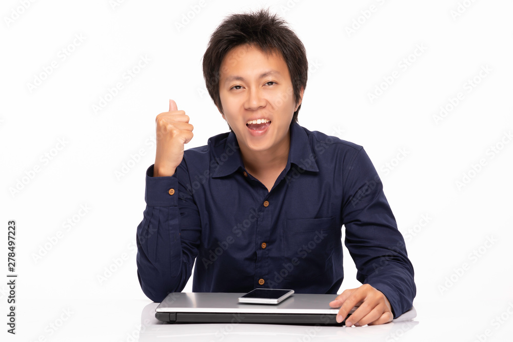 Asian Handsome man wearing casual blue shirt Celebrating with Computer laptop and Smartphone with confident and happiness emotional,Isolated on white background,Asian man Concept Asian Handsome man wearing casual blue shirt Celebrating with Computer laptop and Smartphone with confident and happiness emotional,Isolated on white background,Asian man Concept