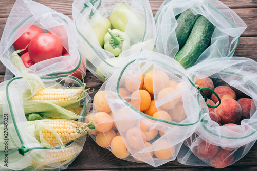 Fruits and vegetables in reusable eco mesh bags. photo