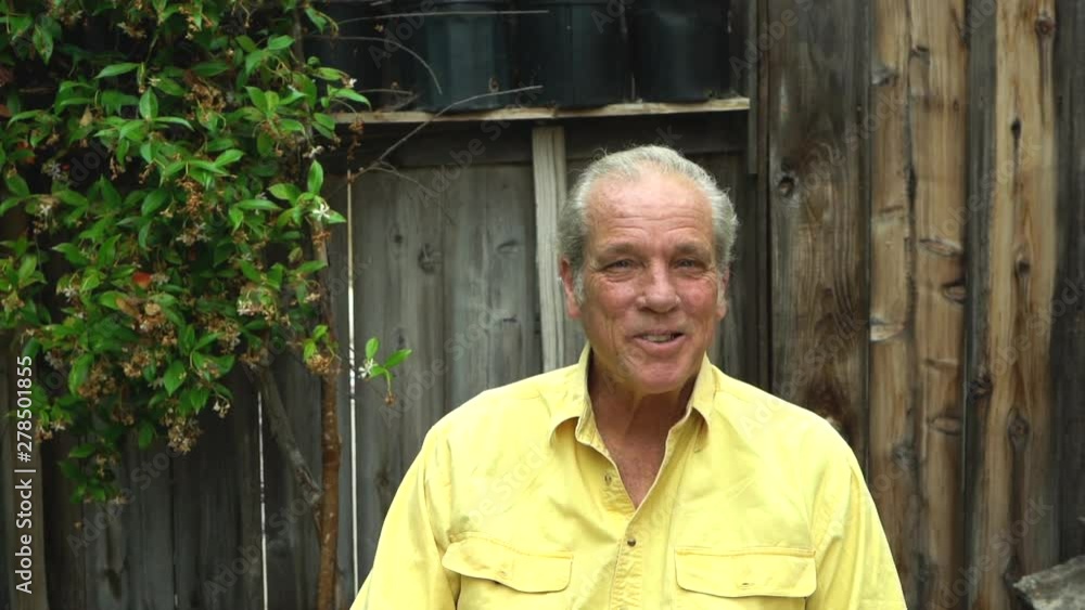 Retired friendly senior man disagreeing and shaking his head while smiling, slow motion Retired friendly senior man disagreeing and shaking his head while smiling, slow motion