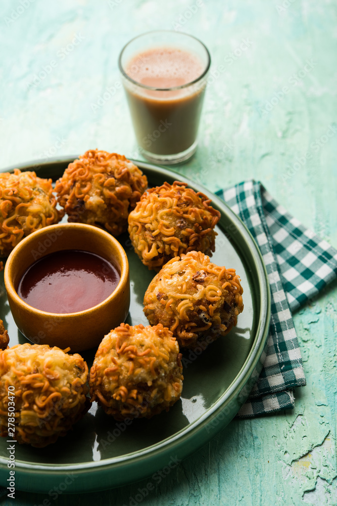 Crispy Noodles/maggie Pakora or pakoda is a popular indochinese street food served with ketchup Crispy Noodles/maggie Pakora or pakoda is a popular indochinese street food served with ketchup