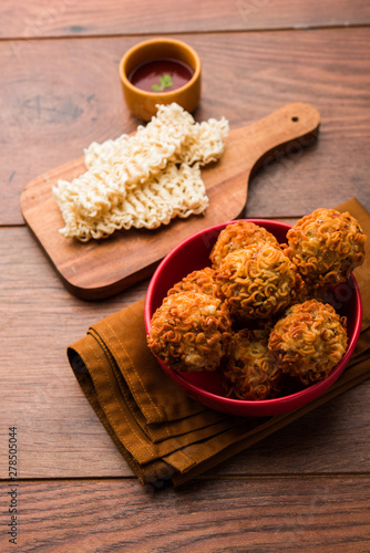 Crispy Noodles/maggie Pakora or pakoda is a popular indochinese street food served with ketchup photo