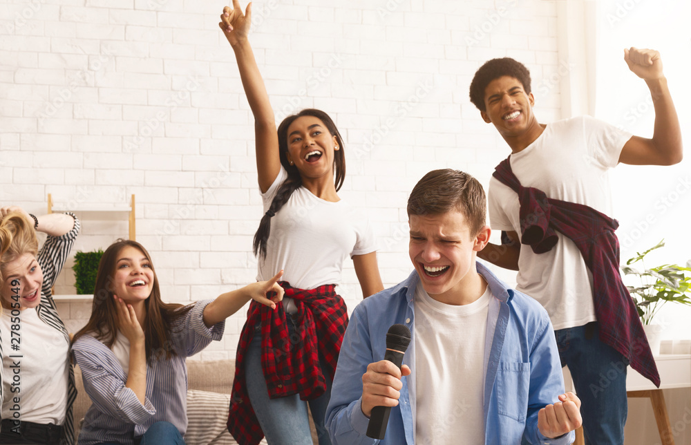 Friends having home party, singing songs together Friends having home party, singing songs together