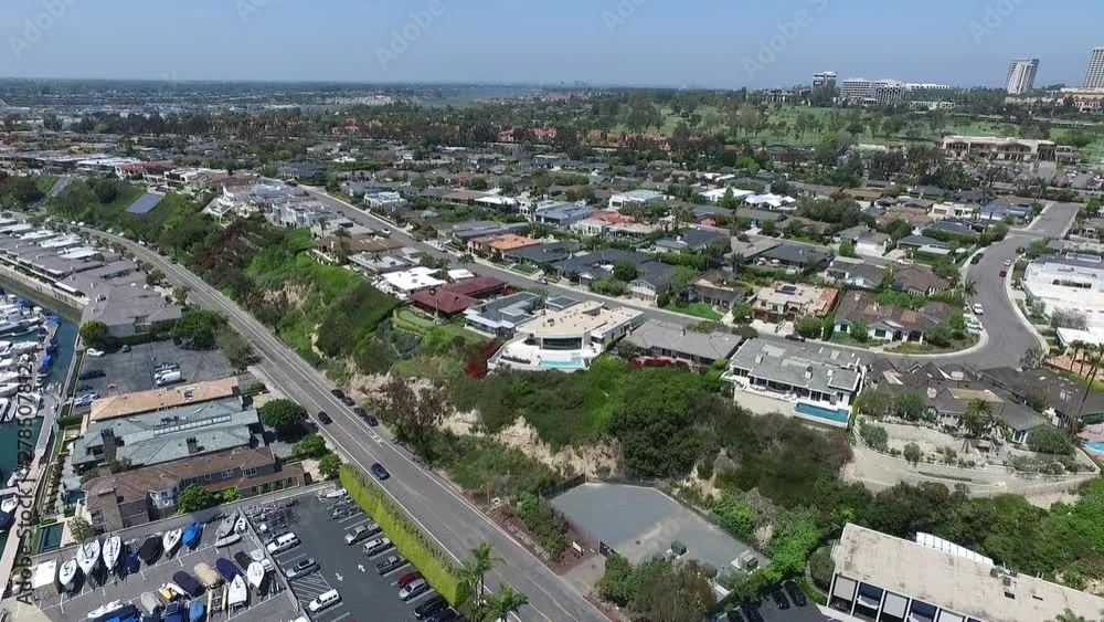 Aerial drone flying over homes in Newport Beach, Orange County, California towards Pacific Coast Highway Aerial drone flying over homes in Newport Beach, Orange County, California towards Pacific Coast Highway